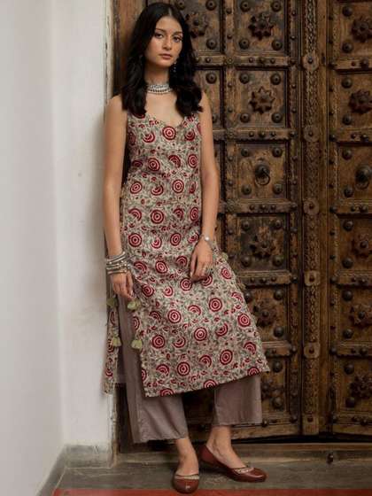 NISHABD Floral
                          Printed V-Neck Calf Length Kurta With
                          Trousers