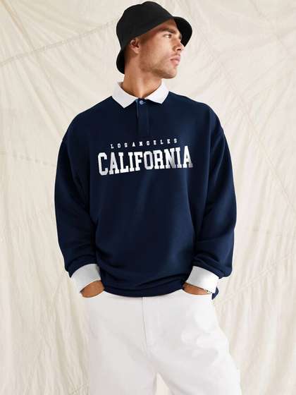 JUMPCUTS Typography
                        Printed Polo Collar Cotton Oversized T-shirt