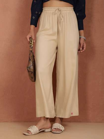 TWIN BIRDS Women
                          Beige Solid Wide Leg Palazzos