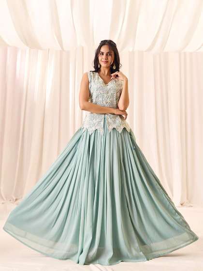 MADHURAM Floral
                          Embroidered Choli With Skirt