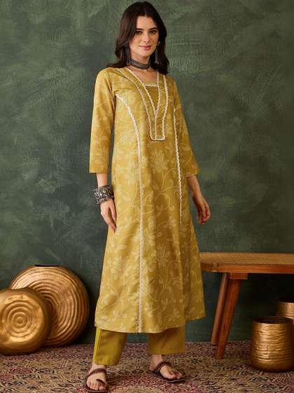 KALINI Women
                          Floral Printed Regular Gotta Patti Kurta with
                          Trousers & With Dupatta