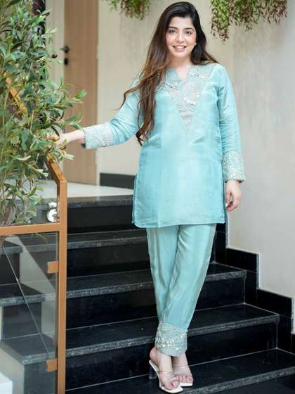 KALINI Women Floral
                        Embroidered Regular Thread Work Kurta with
                        Trousers
