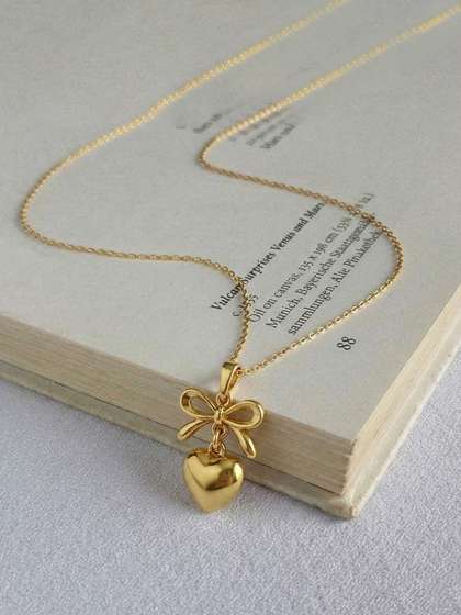 KISNA DIAMOND AND
                          GOLD JEWELLERY 14Kt Gold LoveKnot Pendant -
                          1.15g
