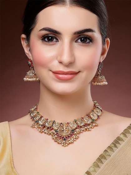 KARATCART
                        Gold-Plated Kundan-Studded Laxmi Mata and
                        Peacock Temple Necklace and Earrings