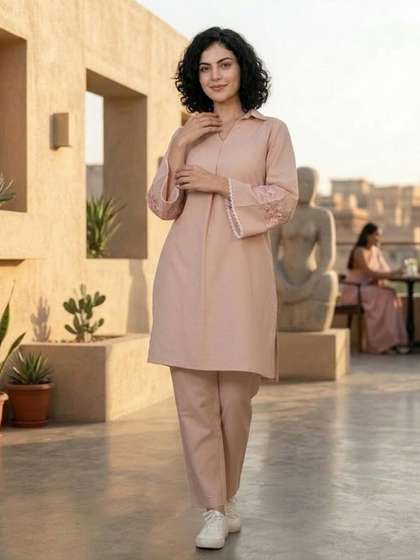 Varanga
                        Peach-Coloured Floral Embroidered Shirt Collar
                        Thread Work Kurta With Trousers