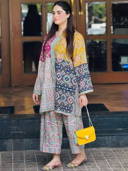 NESH CREATION Women
                        Floral Printed Regular Kurti with Palazzos