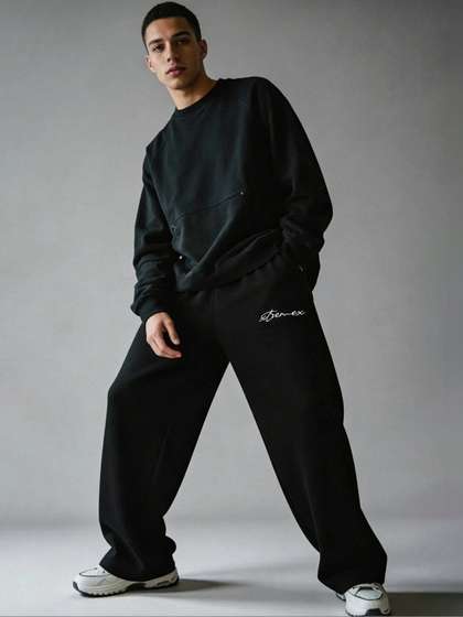 XTREMEX Men Baggy
                      Everyday Black Solid Track Pants