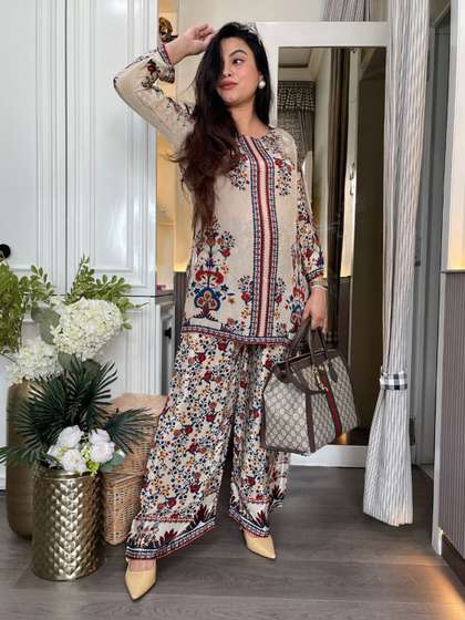 Aaghnya Women's Cream
                      Rayon Blend Printed Straight Kurta With Trousers