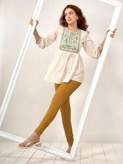 LYRA Women Golden
                        Yellow Solid Churidar Length Leggings