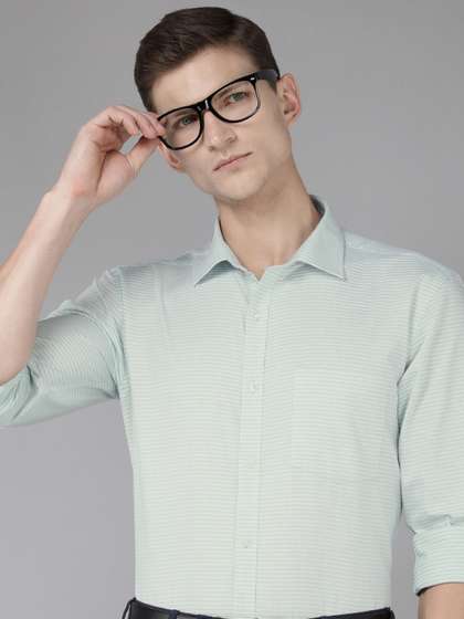 Park Avenue Pure
                        Cotton Self Design Textured Slim Fit Formal
                        Shirt