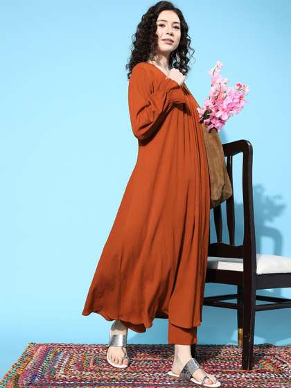 Varanga Women Rust
                        Orange Solid Textured Gathered Kurta with
                        Trousers
