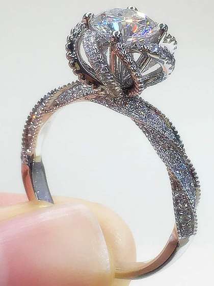 Designs & You
                        Silver-Plated American Diamond Studded Crushed
                        Ice Cut Twisted Finger Ring