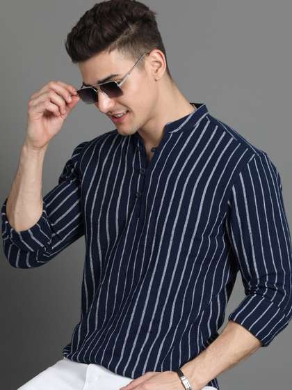 HERE&NOW
                          Mandarin Collar Printed Flared Sleeves Thread
                          Work Cotton Short Kurta