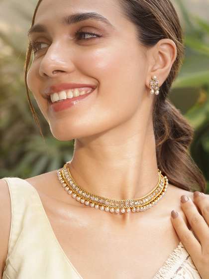 Rubans 22K
                        Gold-Plated White Kundan Studded & Pearl
                        Beaded Handcrafted Jewellery Set