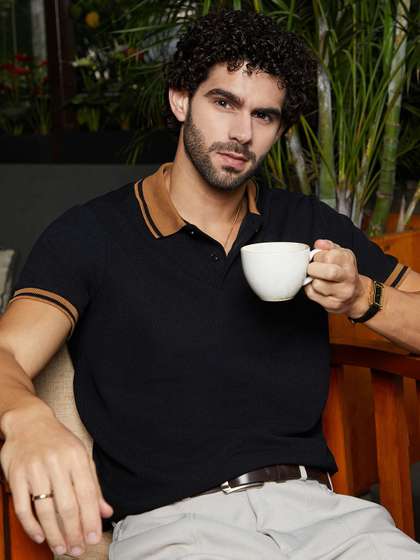Campus Sutra Men
                        Solid Polo Collar Cotton T-shirt