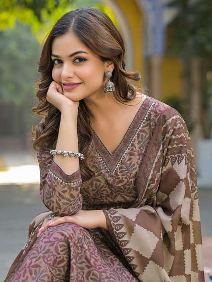 KALINI Floral
                        Printed V Neck Gotta Patti Straight Kurta With
                        Trousers & Dupatta