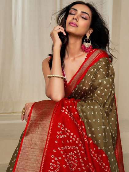 Kalini Women
                            Dola Silk Bandhani Print Zari border Saree