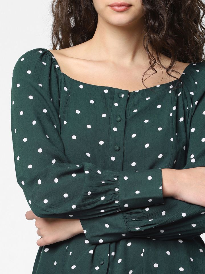 Green and white polka dot top shop