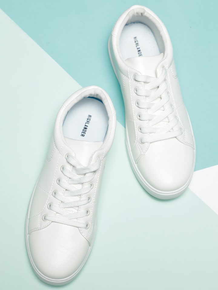 Premium AI Image | White sneakers isolated on a white background-sonxechinhhang.vn