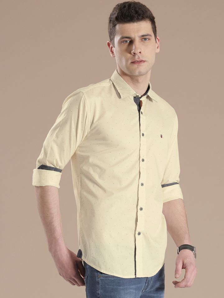 Cream shirt shop and blue jeans