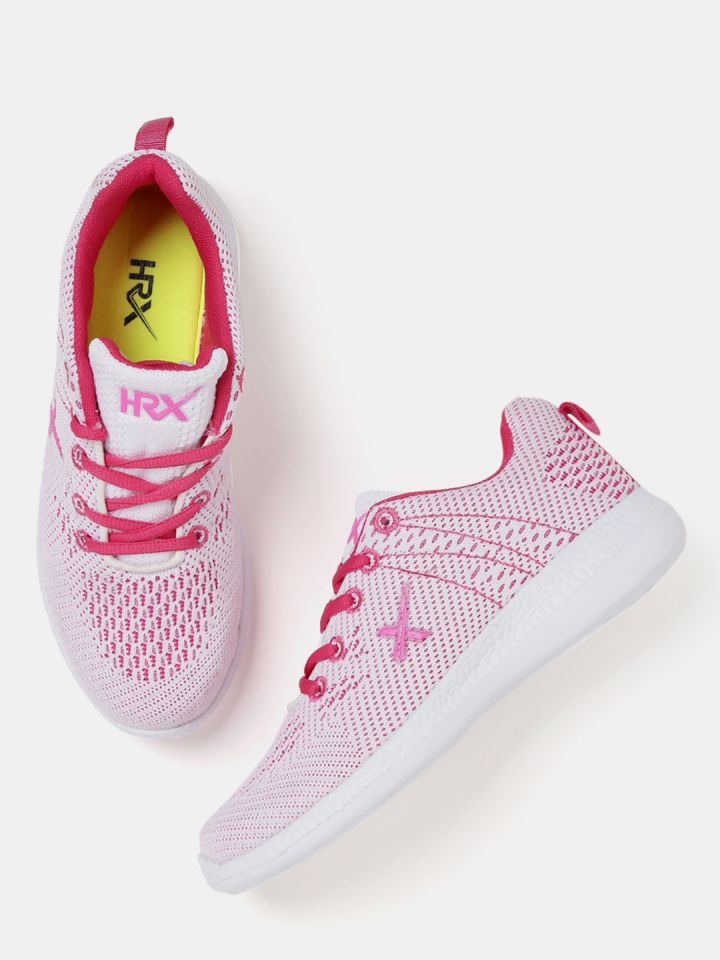 white and pink running shoes