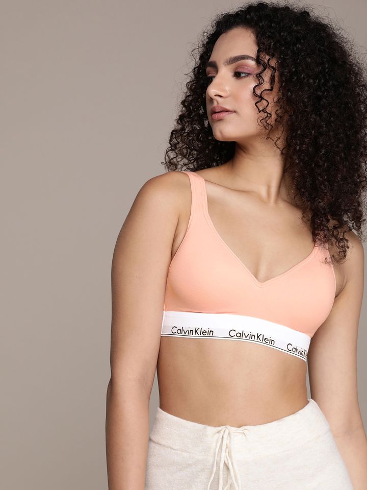 Buy Calvin Klein women lightly padded brand logo sports bra peach Online
