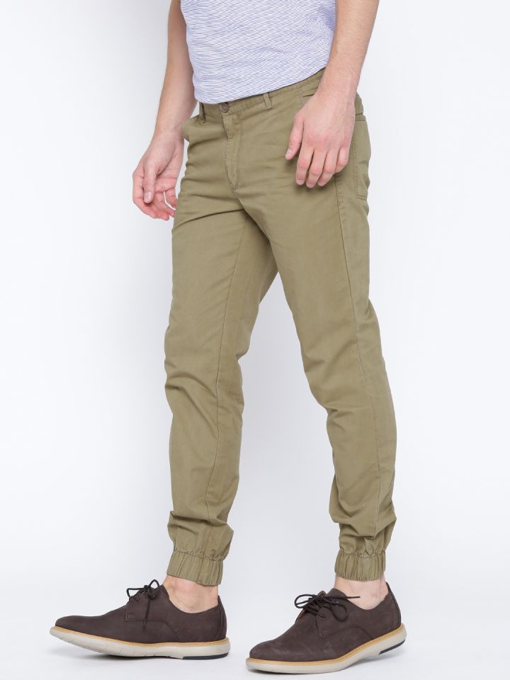 Buy John Players Men Khaki Solid Slim Fit FlatFront Trousers on Myntra   PaisaWapascom