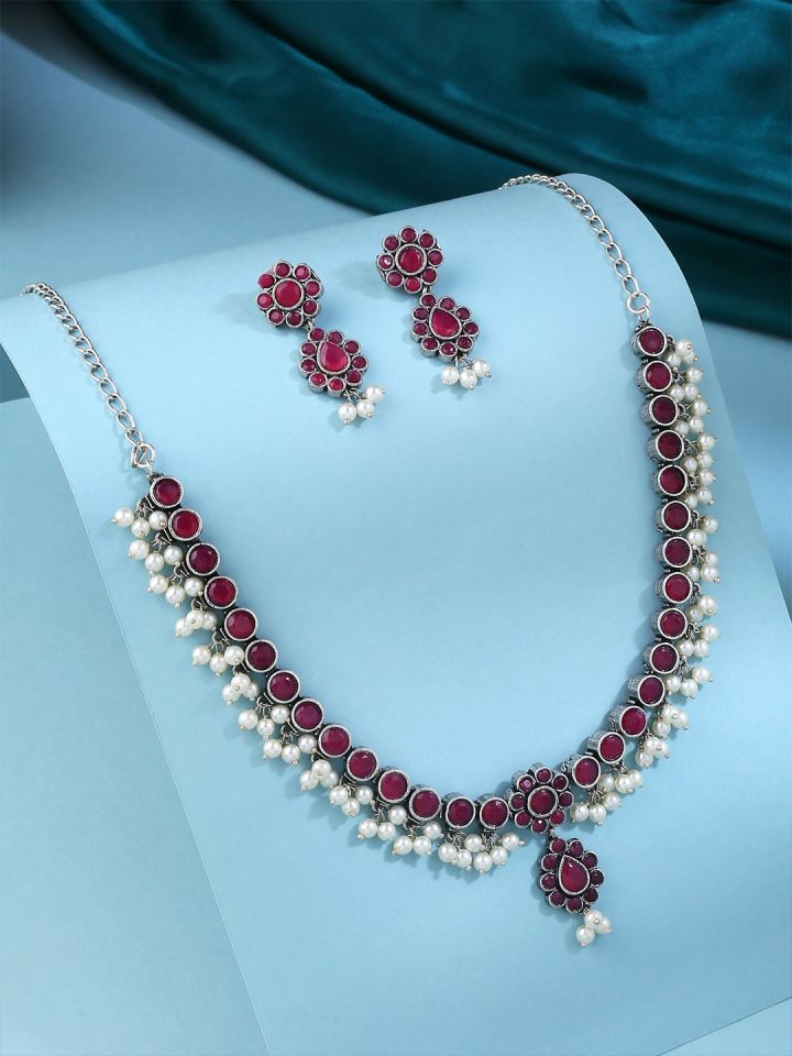 Rubans Oxidised Silver Handcrafted Ruby Studded Peacock Necklace Set.