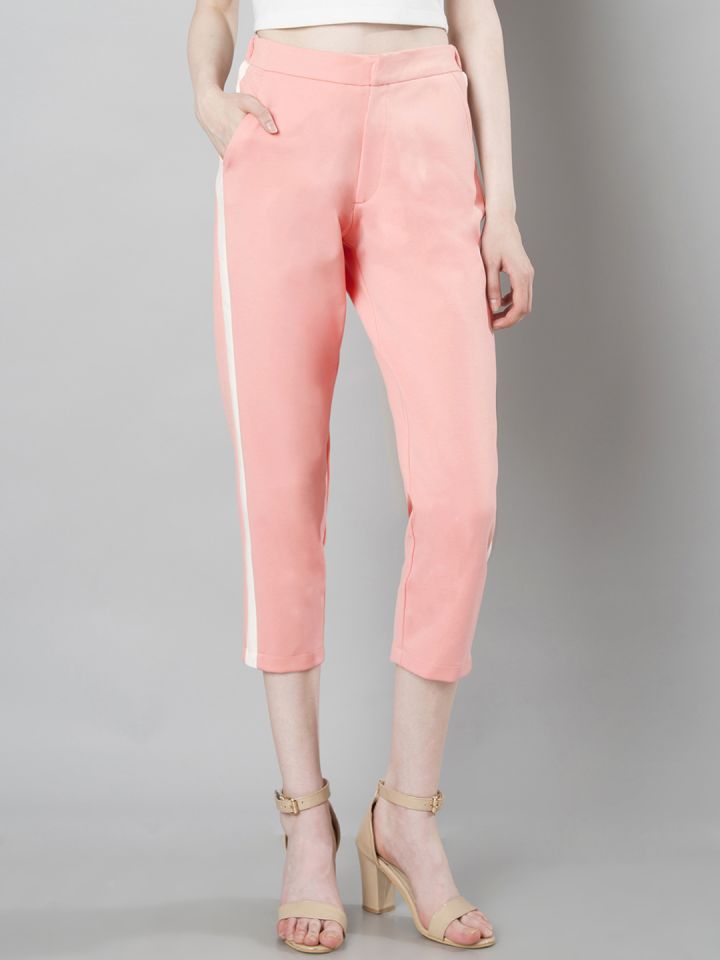 Female casual peach color jeans Girls new middle waist trousers folded on  white background Female spring or summer skinny pants on sale Photos   Adobe Stock