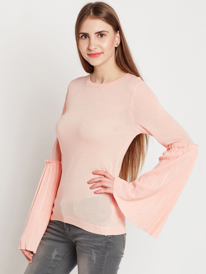 peach color top with jeans