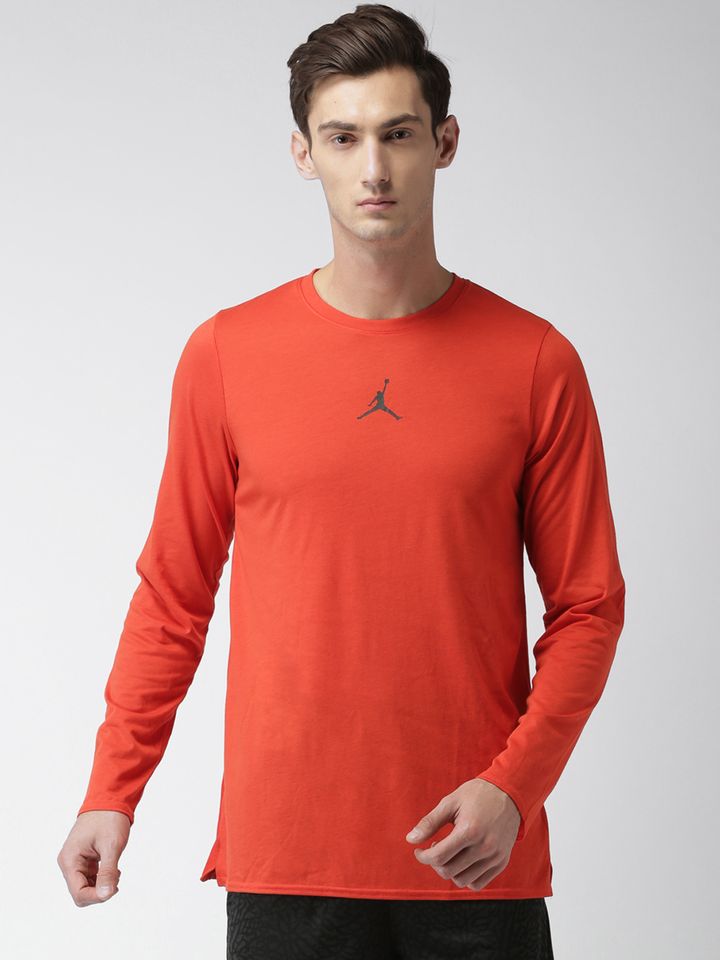 orange and red nike shirt