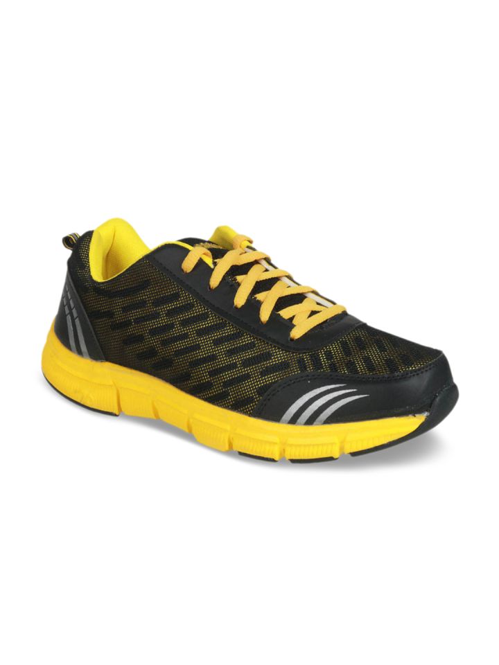 yellow and black gym shoes