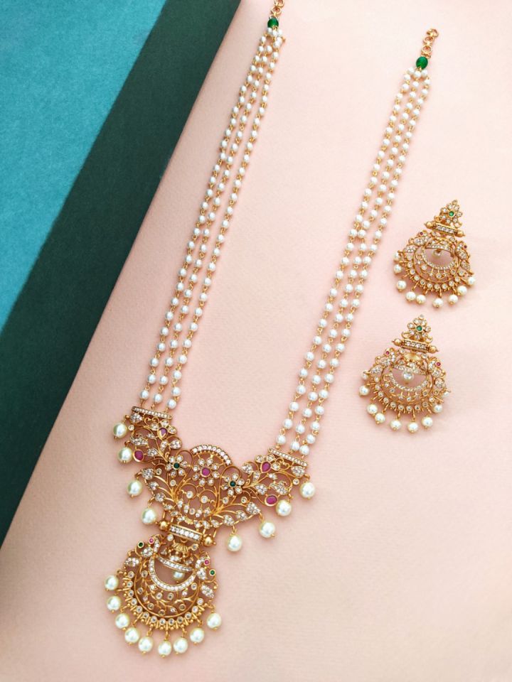 Long gold store necklace with pearls