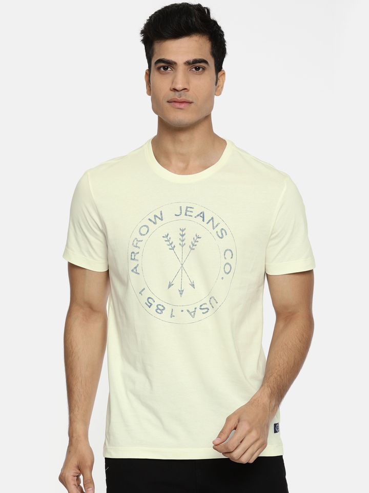 cream shirt and blue jeans