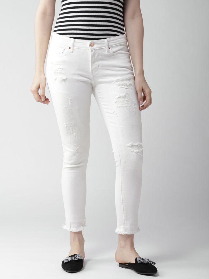 white distressed levi jeans