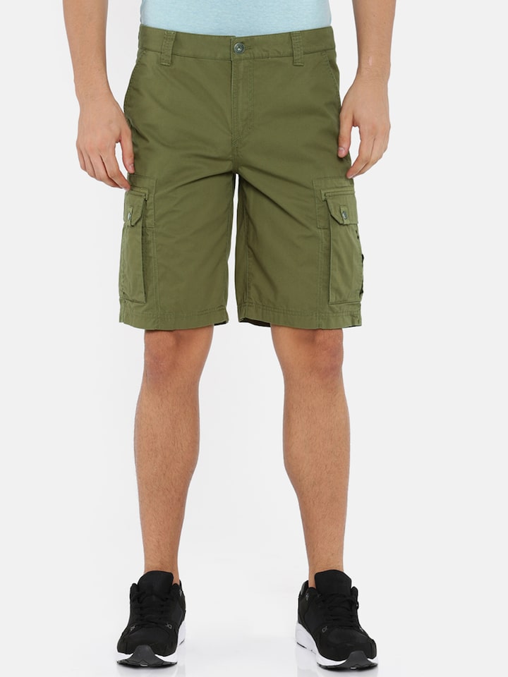 green puma shorts