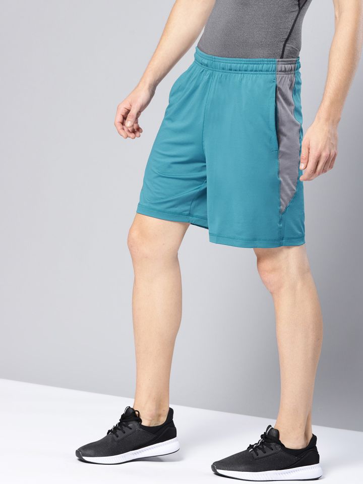 Buy UNDER ARMOUR Men Teal Blue Raid 8 Solid Sports Shorts Shorts