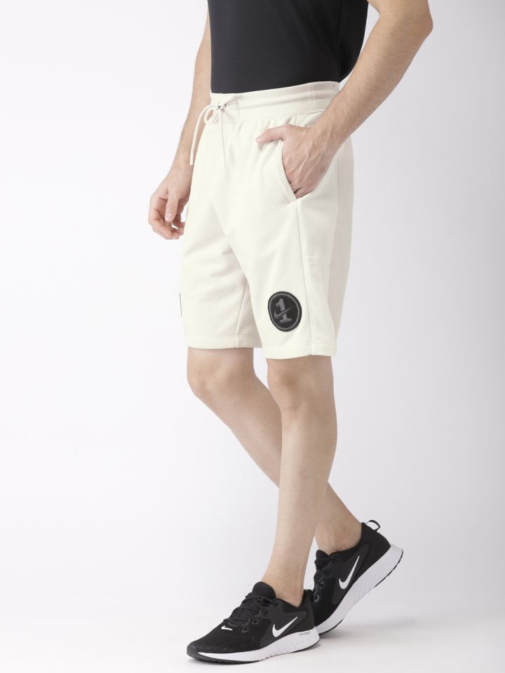 Precio short hot sale
