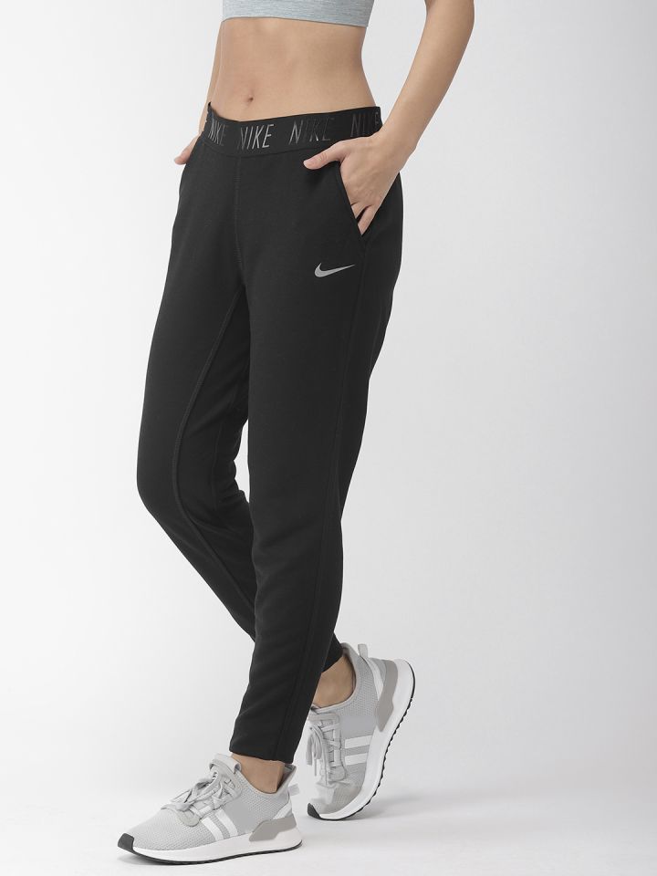 Buy Nike Women Black Solid DRY FIT TAPERED NFS Track Pants - Track Pants  for Women 9164393