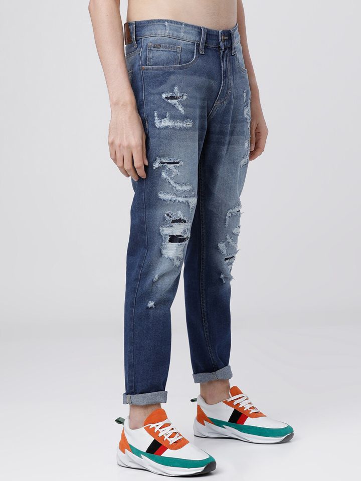 Buy HIGHLANDER Men Blue Tapered Fit Mid Rise Highly Distressed Jeans -  Jeans for Men 13815362