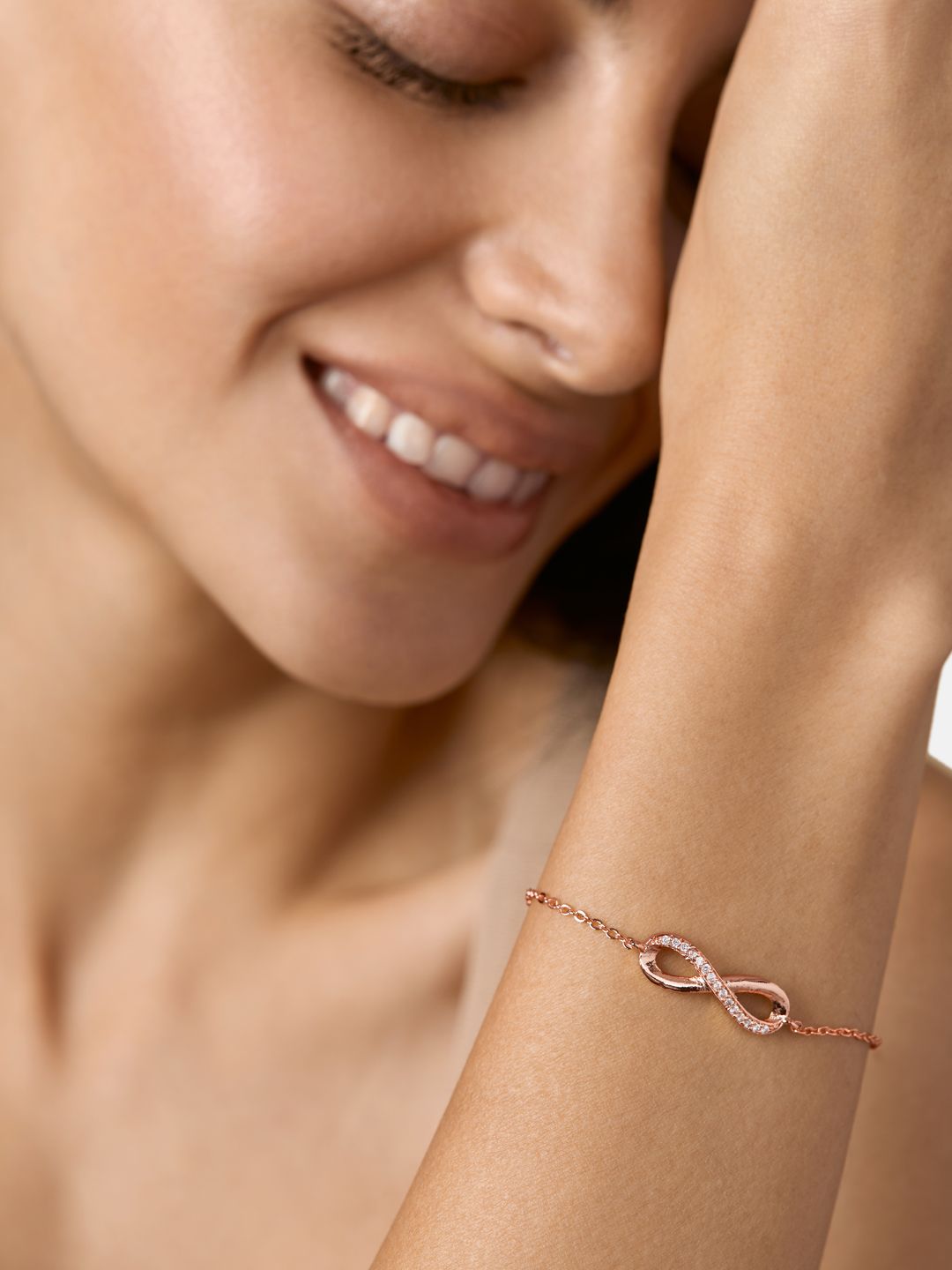 MINUTIAE Women Brass Crystals Handcrafted Rose Gold-Plated Infinity Link Bracelet