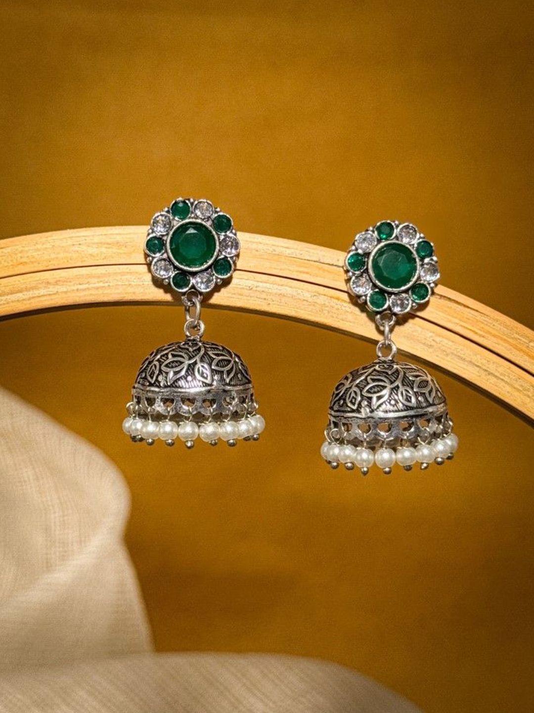 NAMAN ARTS Silver-Plated Artificial Stones Studded and Beaded Dome Shaped Oxidised Jhumkas