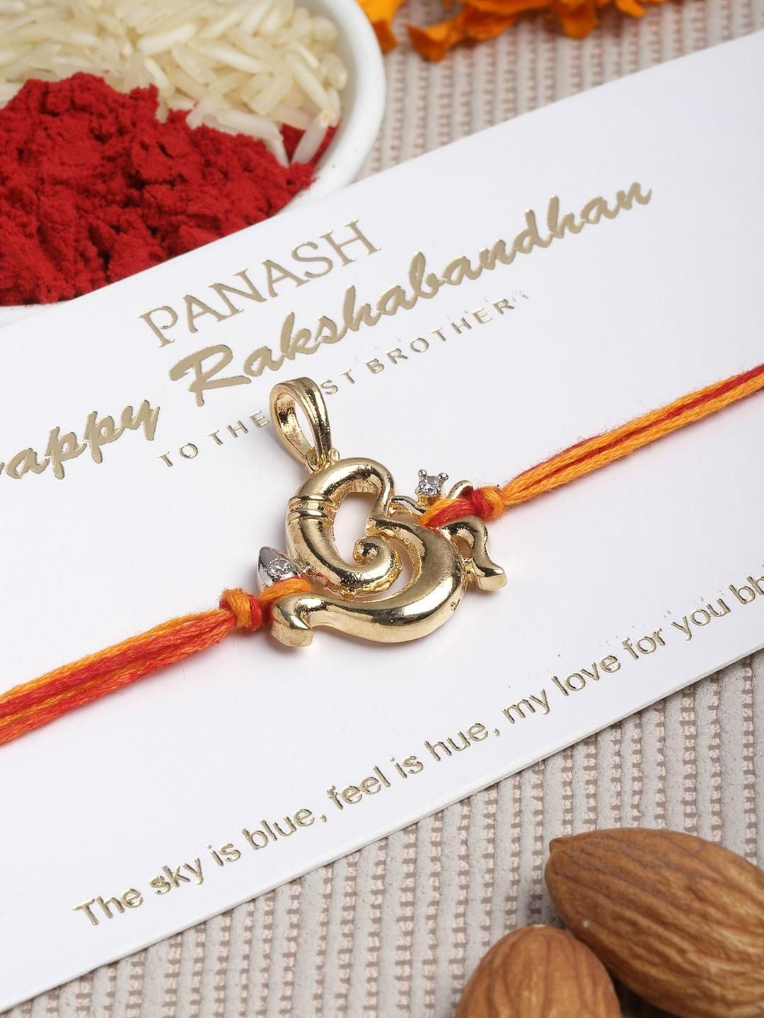 PANASH Gold Plated Artificial Stones Studded Ganesha Thread Rakhi With Roli Chawal