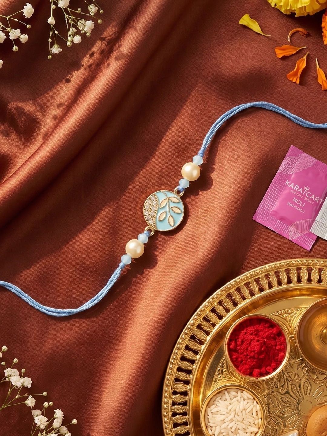 KARATCART Blue Meena Leaf Design Kundan Rakhi with Roli & Chawal