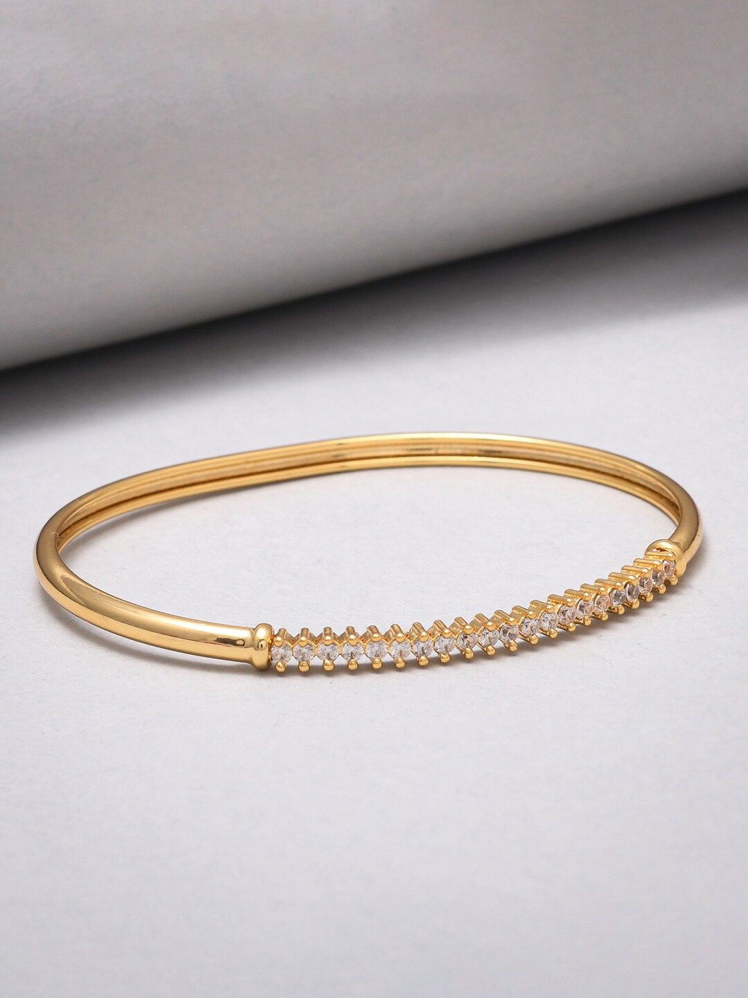 Sparkling Elegance Round Cut CZ Adorned Gold Plated Brass Bracelet