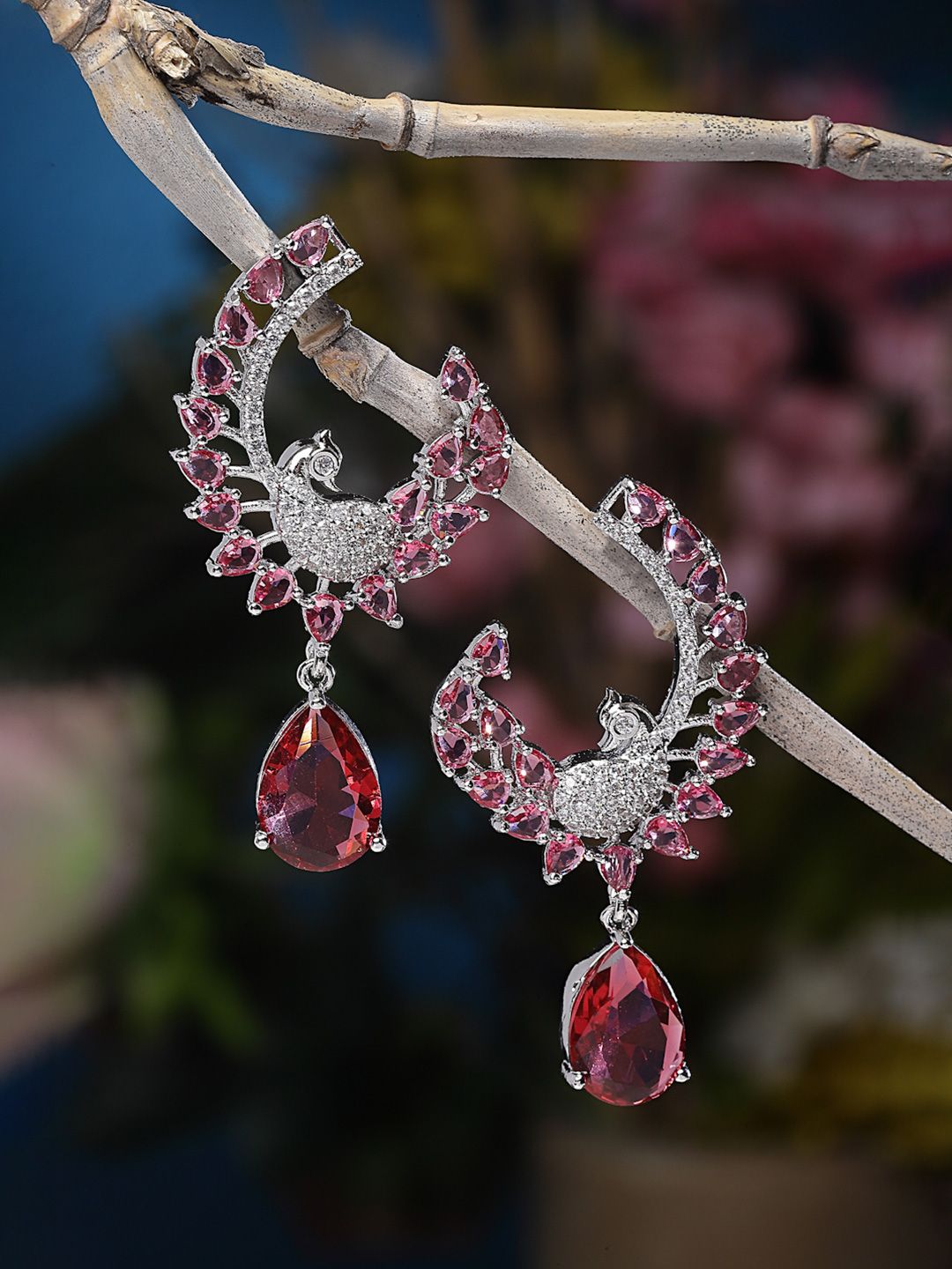 Rhodium-Plated Red American Diamond Studded Peacock Shaped Drop Earrings