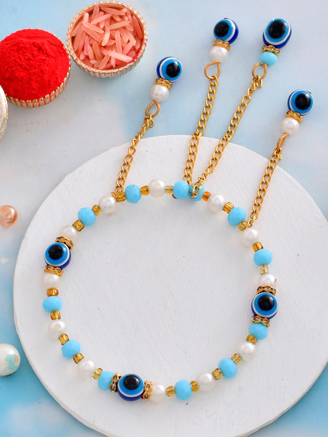 Blue Beads And White Pearls Tassels Rakhi For Sister