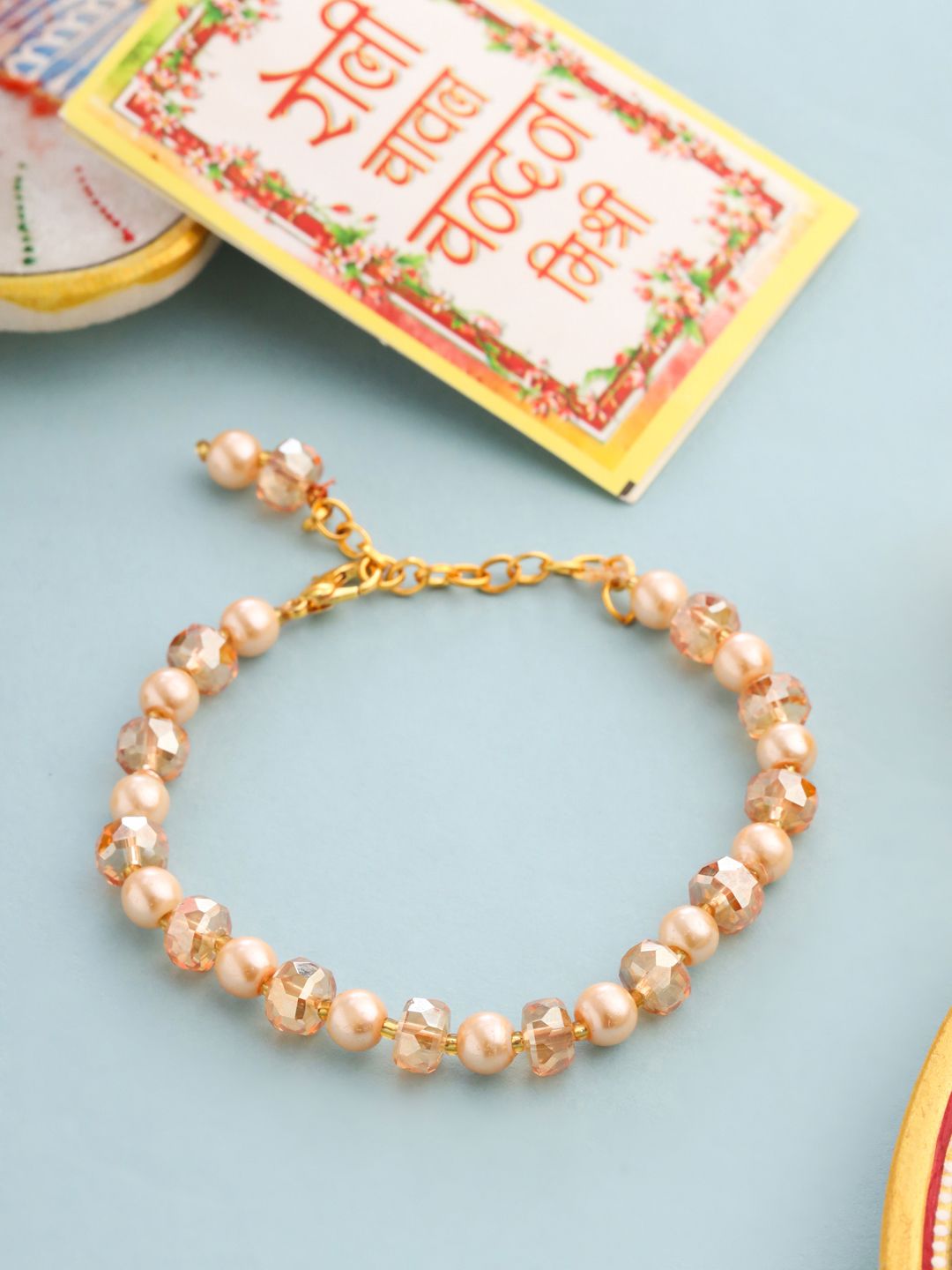Buy NVR Women Gold Toned Artificial Beads Wraparound Rakhi With Roli Chawal Chandan & Mishri -  - Accessories for Women