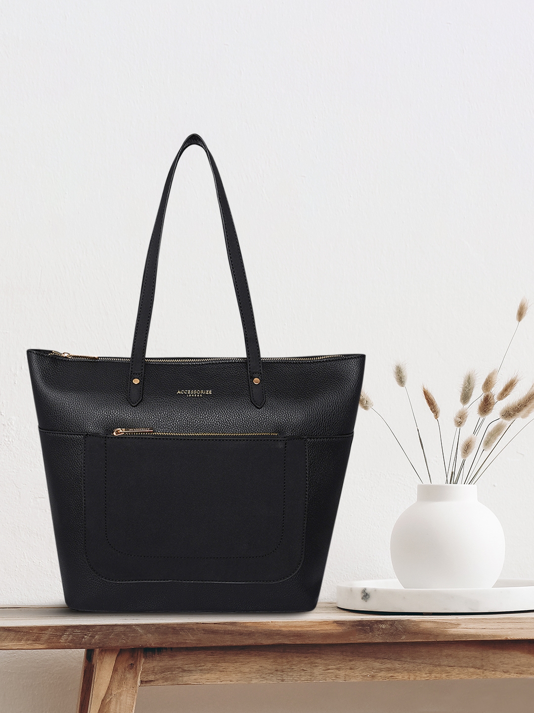 Black handbags accessorize sales