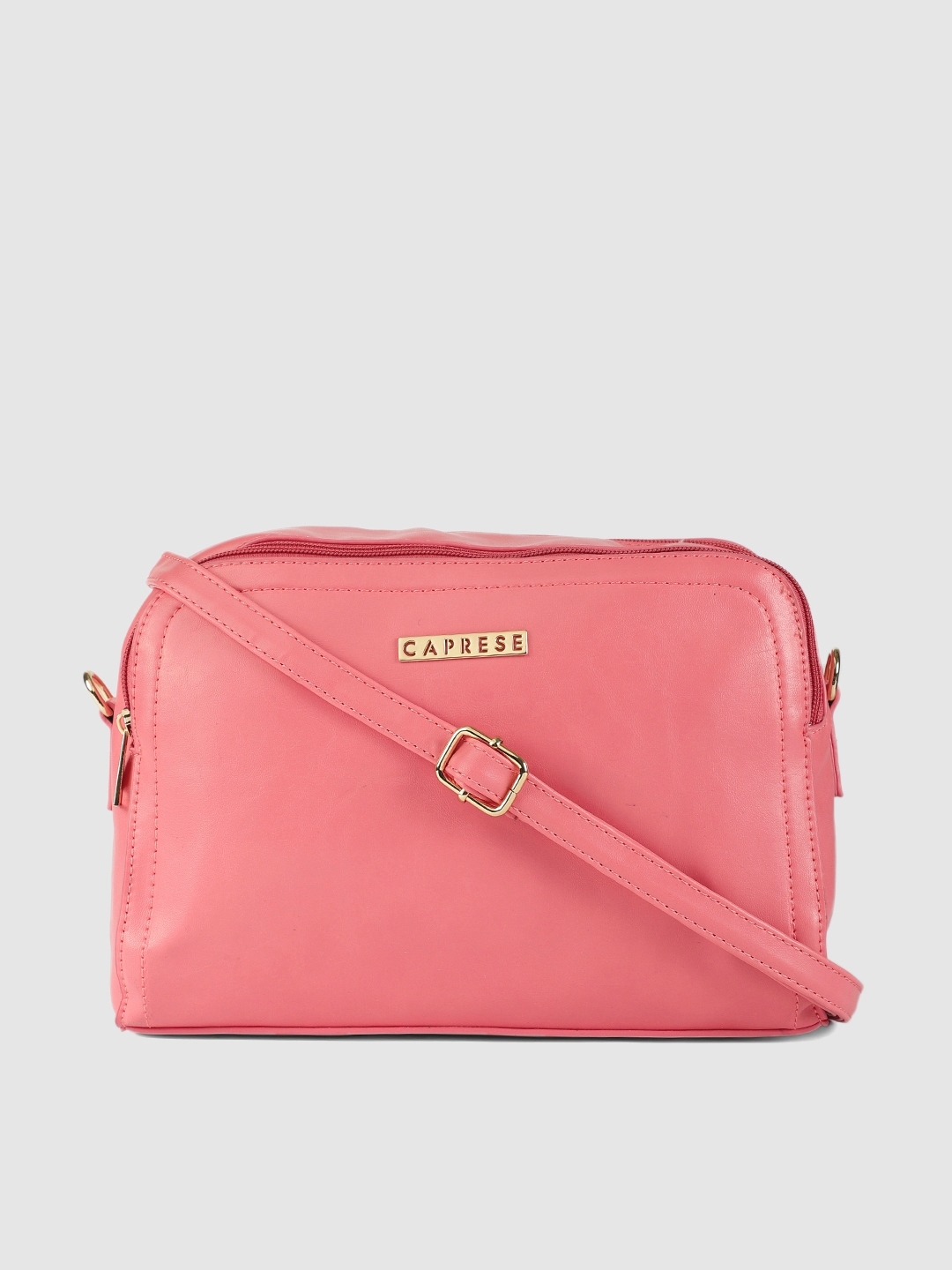 Caprese pink solid sling bag on sale